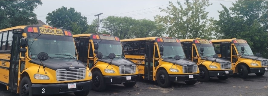 Row of yellow school buses from the Ramon Transportation fleet